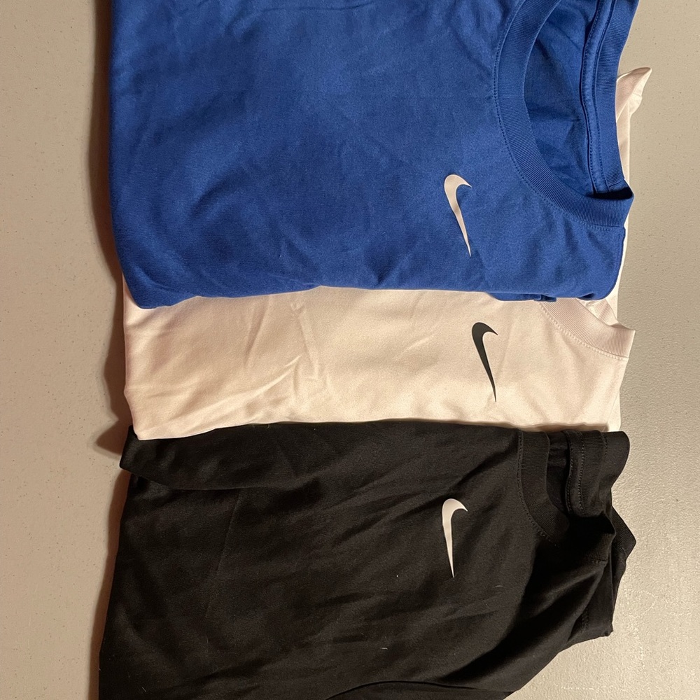 Nike athletic short sleeve shirts, set of three.